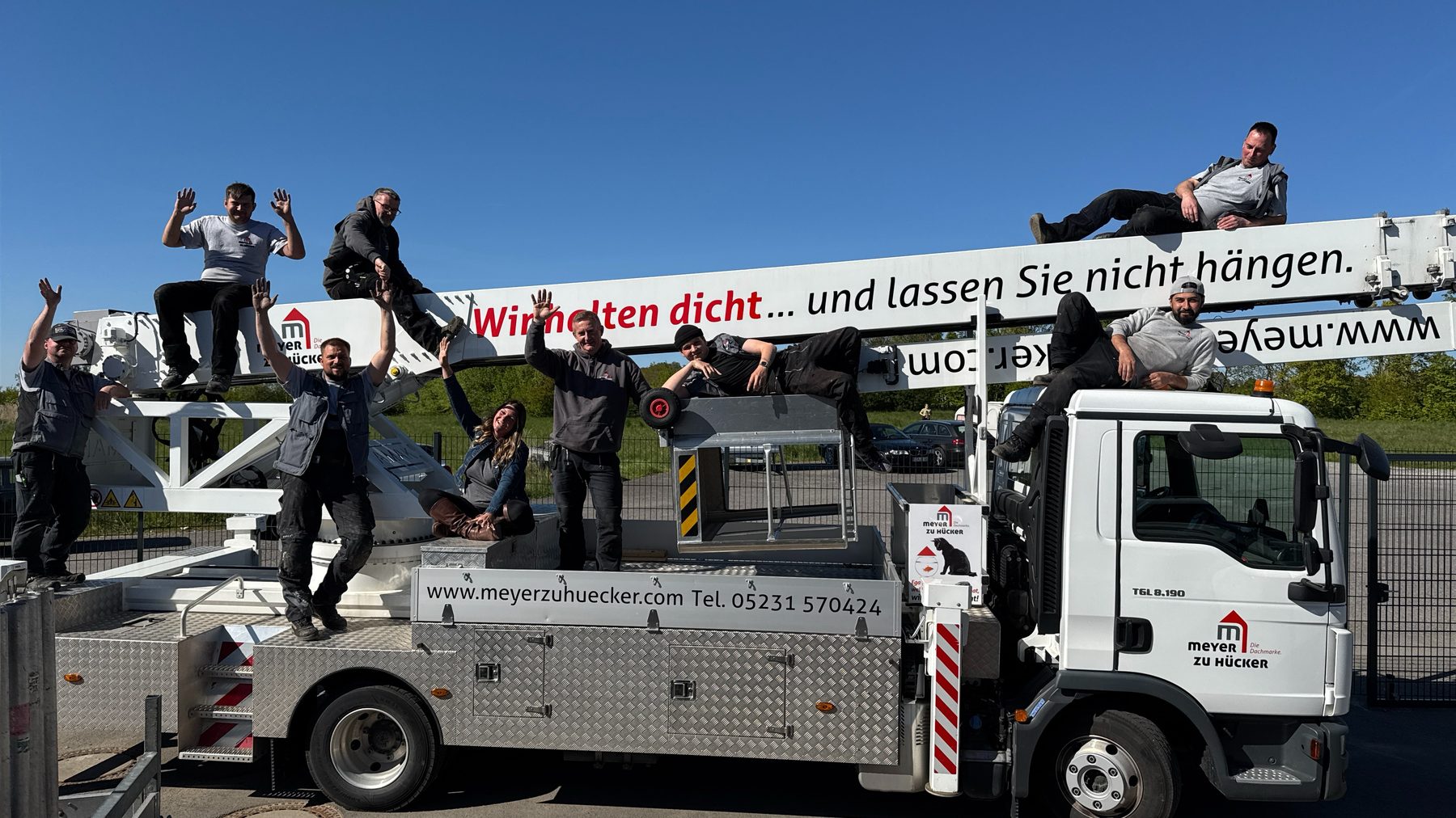 Das Team auf dem Kran-Ausleger